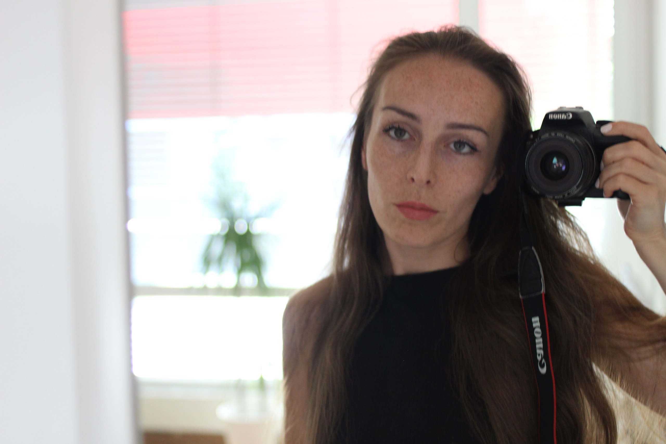 Kateryna Herasymchuk self portrait with a camera